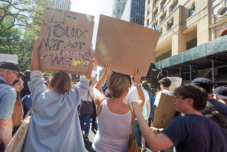 Rome Dimmick will soon peel away with his father as his mother, Christine, and Lila Kerns march on. Photo: Carl Glassman/Tribeca Trib